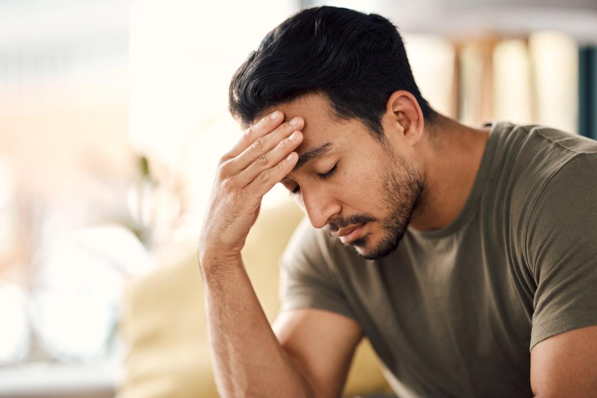 Man experiencing emotional distress related to bulimia nervosa and eating disorder symptoms.