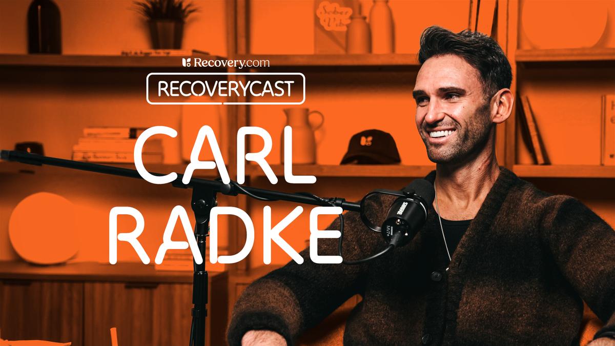 Orange-toned podcast graphic showing a smiling man speaking into a microphone in a studio, with on-screen text reading ‘Recovery.com,’ ‘Recoverycast,’ and ‘Carl Radke,’ and shelves in the background.