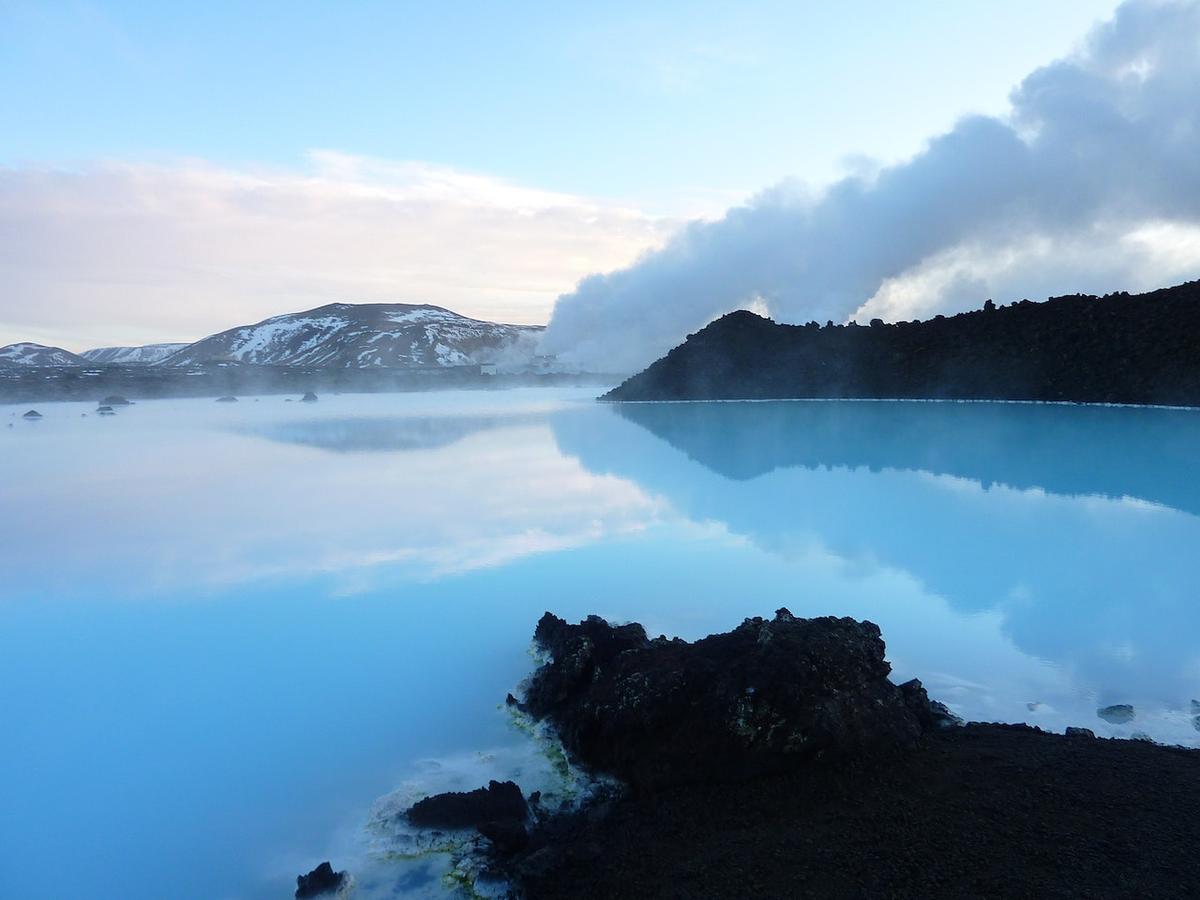 The Blue Lagoon in Iceland, showing the opaque, light-blue water reflecting the sky.