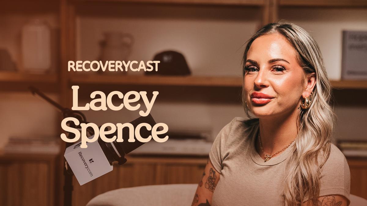 Recoverycast podcast guest Lacey Spence sits beside a microphone with Recovery.com branding in a warm-toned recording studio setting.