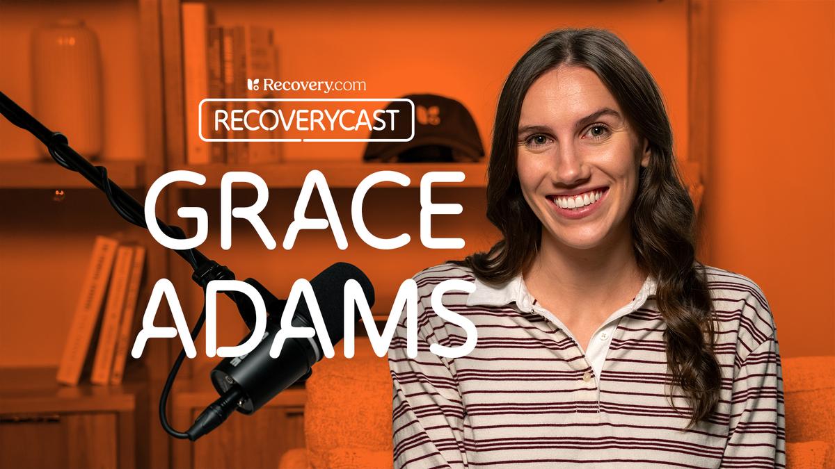 Grace Adamas sits in a podcast studio with a microphone, with on-screen text reading “Recoverycast” and “Grace Adams,” set against a warm orange background with shelves behind her.