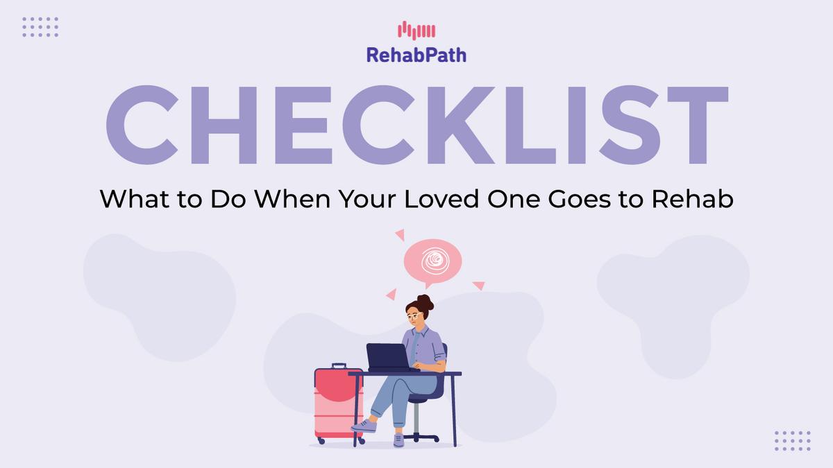 Graphic titled ‘CHECKLIST: What to Do When Your Loved One Goes to Rehab’ with the RehabPath logo at the top. Below the headline is an illustration of a person sitting at a desk using a laptop next to a suitcase, suggesting preparation and planning for a loved one entering rehab.