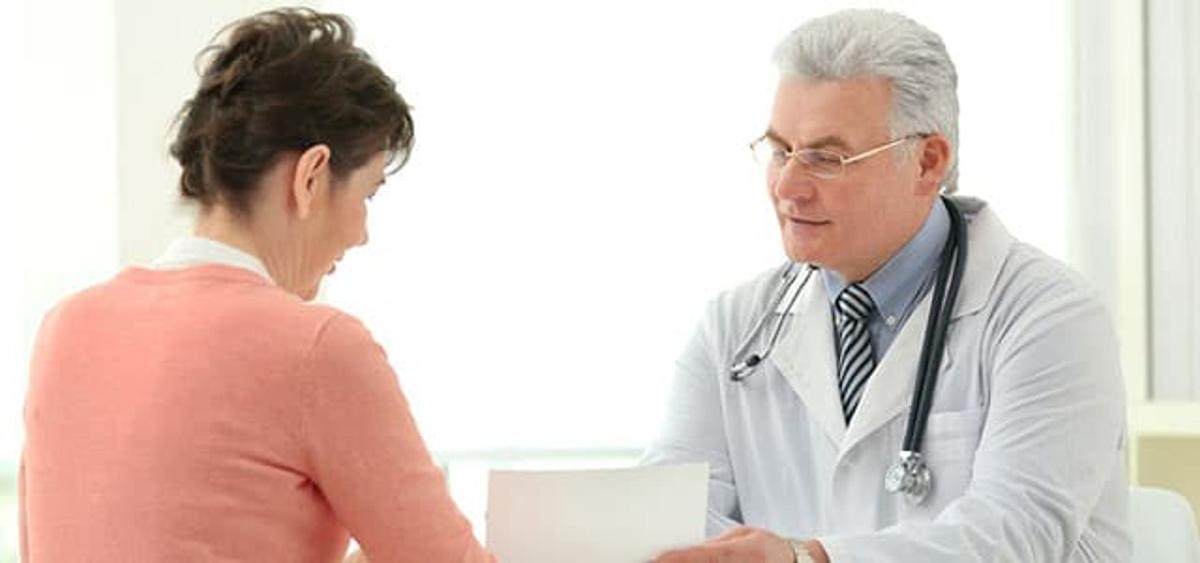 Patient in consultation with doctor, representing the medical supervision required for medication-assisted treatment of opioid use disorder