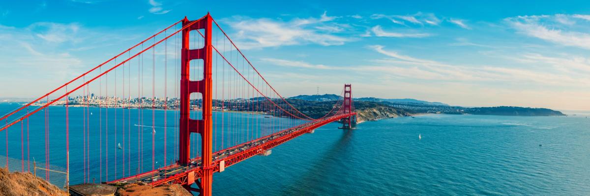 Wide view of the Golden Gate Bridge spanning San Francisco Bay under a bright blue sky, symbolizing the concept of California sober and a balanced approach to recovery.