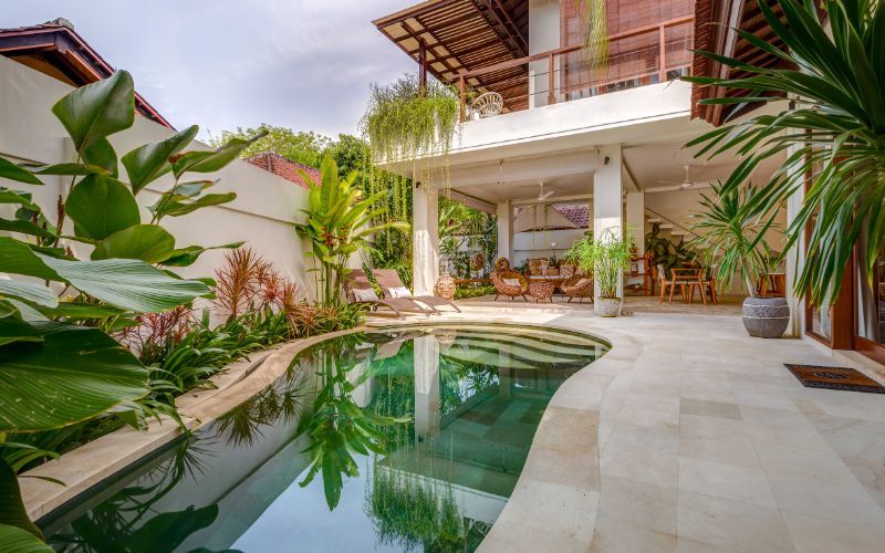 Tropical luxury rehabilitation facility with private pool surrounded by lush vegetation and modern architecture