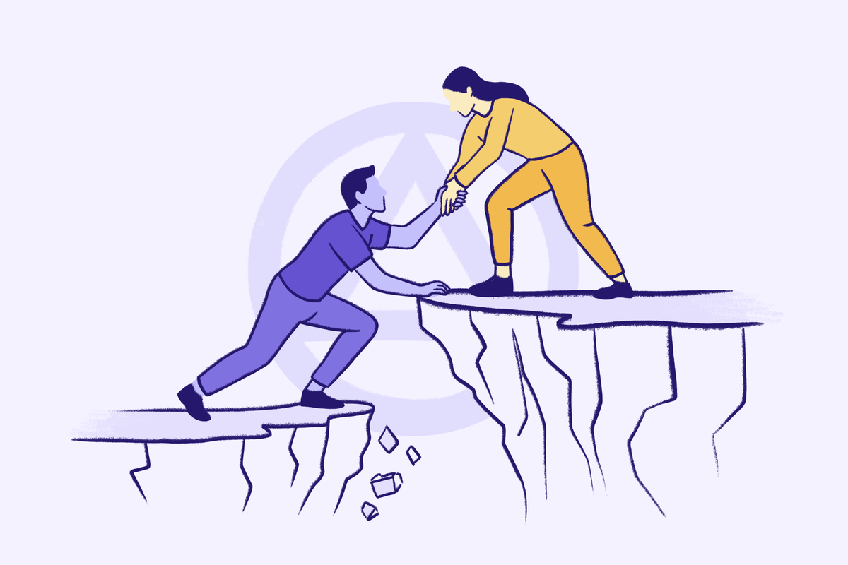 Person helping another person climb up from a rocky cliff gap symbolizing support mentorship and recovery journey.