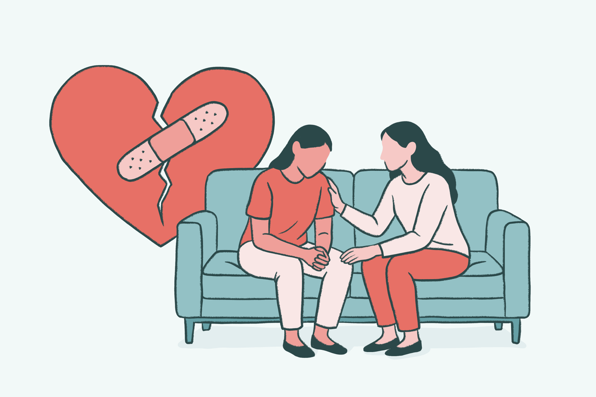 Illustration of two people sitting on a couch, one offering comfort to the other, with a bandaged broken heart in the background, representing the process of making amends and repairing relationships in addiction recovery