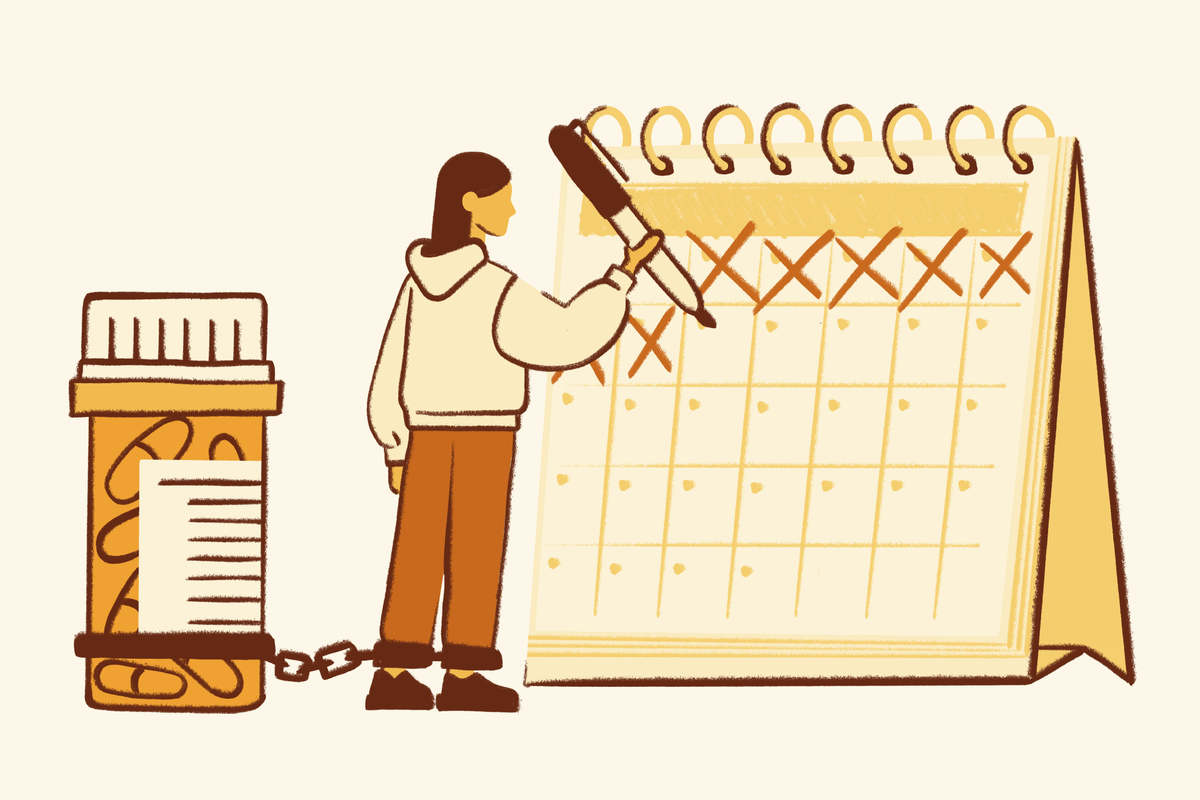 An illustration of a person chained by their ankle to a large prescription pill bottle while they mark off days on a desk calendar with an oversized pen.