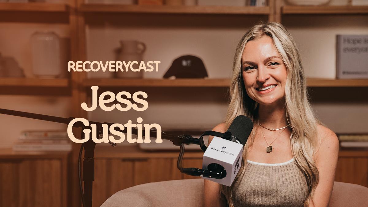 Recoverycast podcast cover featuring guest Jess Gustin smiling while seated in front of a microphone in a warm-toned recording studio. 